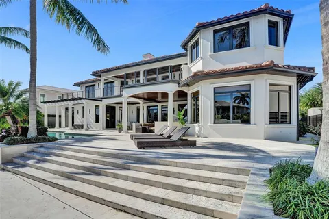 a bathroom with a sink vanity granite toilet and shower