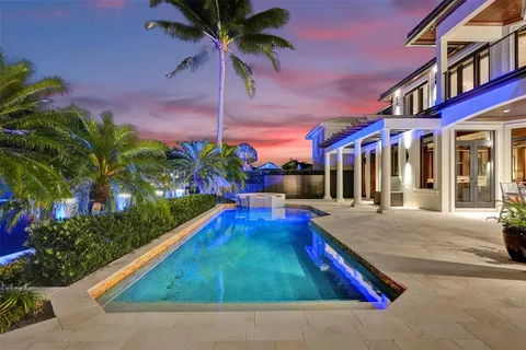 an aerial view of a residential houses with city view