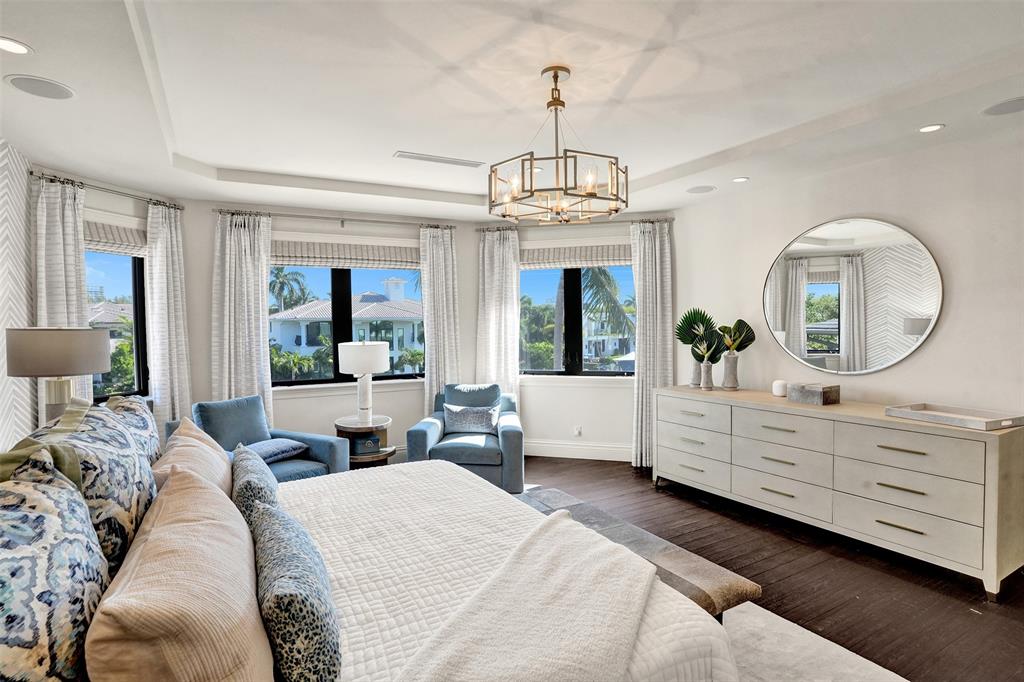 35 Compass Isle Fort Lauderdale, FL 33308 - Photo 55 of 90 a large bedroom with a large bed and a chandelier