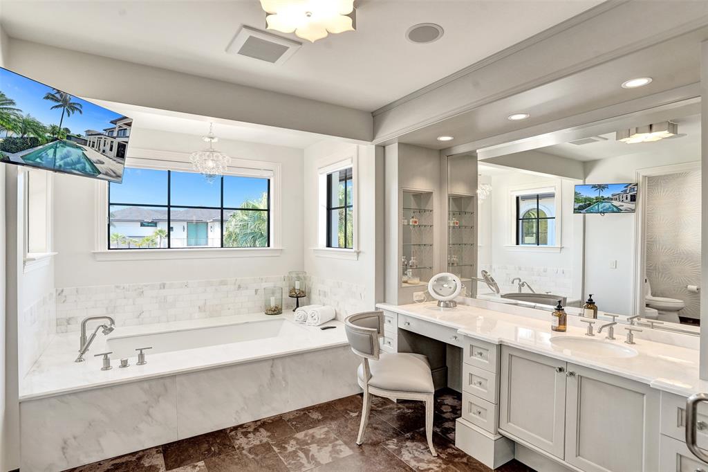 35 Compass Isle Fort Lauderdale, FL 33308 - Photo 60 of 90 a bathroom with a granite countertop sink mirror and a bathtub