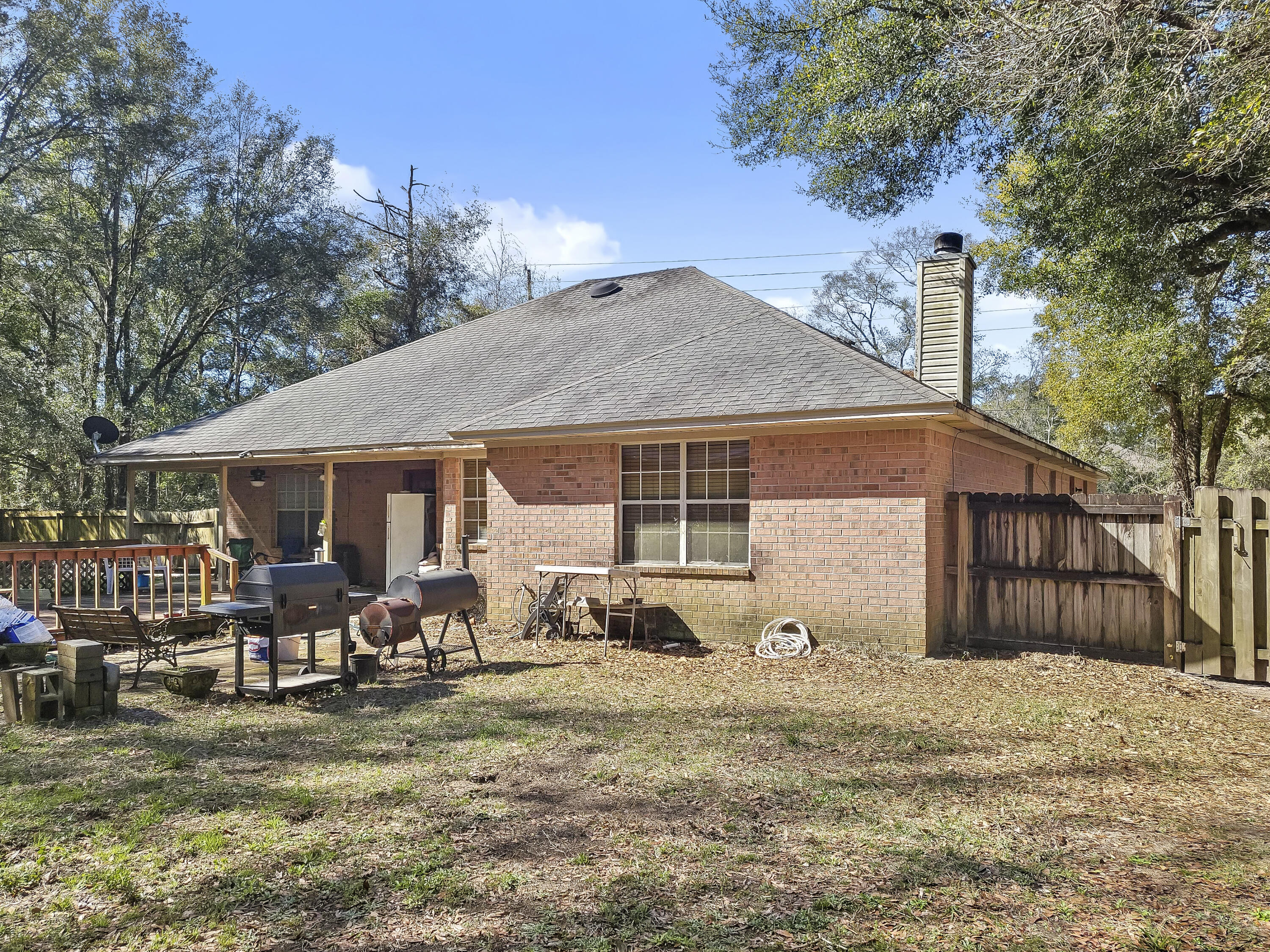 4970 East Spencer Field Road Pace, FL 32571 - Photo 15 of 15 a front view of a house with garden