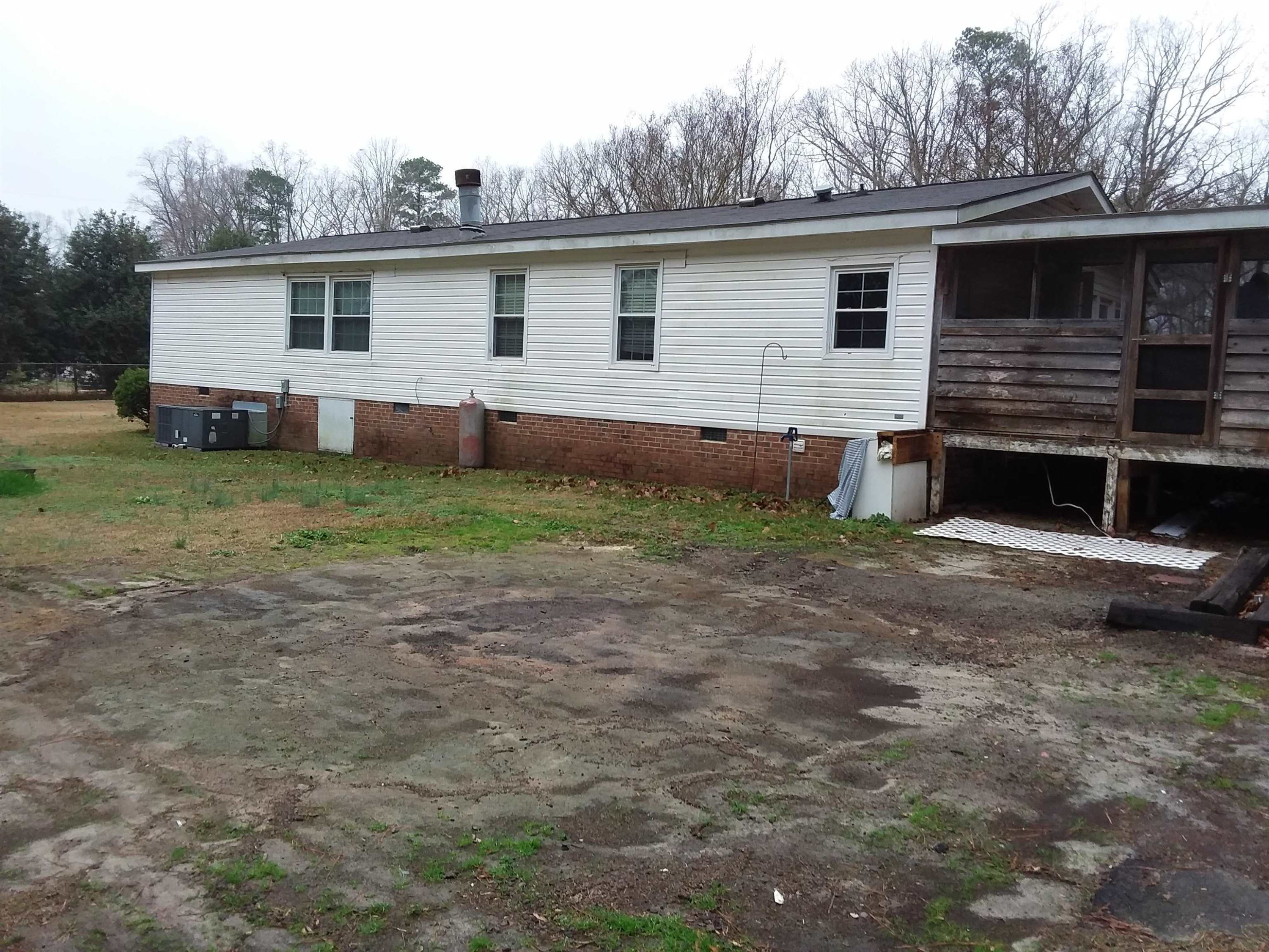4644 Dusty Road Raleigh, NC 27610 - Photo 4 of 12 former tenant had a swimming pool attached at back of deck Exterior Back