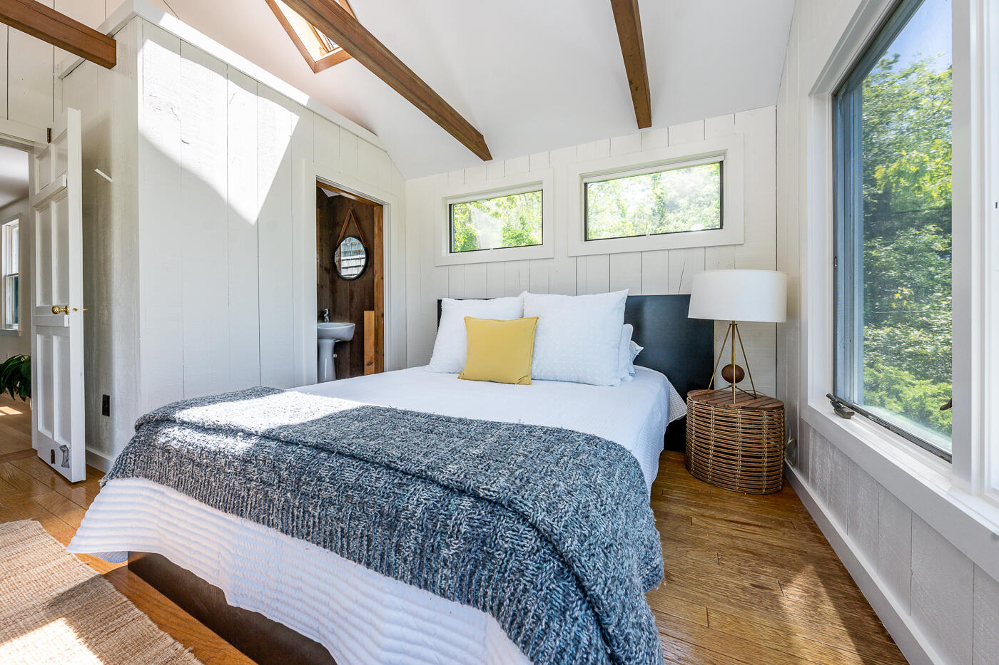 52 Captain Linnell Road Orleans, MA 02653 - Photo 17 of 41 a bedroom with a large bed and a large window