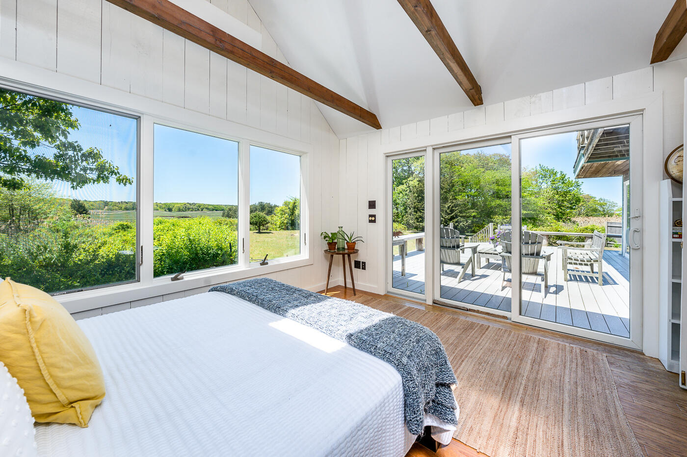 52 Captain Linnell Road Orleans, MA 02653 - Photo 18 of 41 a bed sitting in a spacious bedroom next to a large window