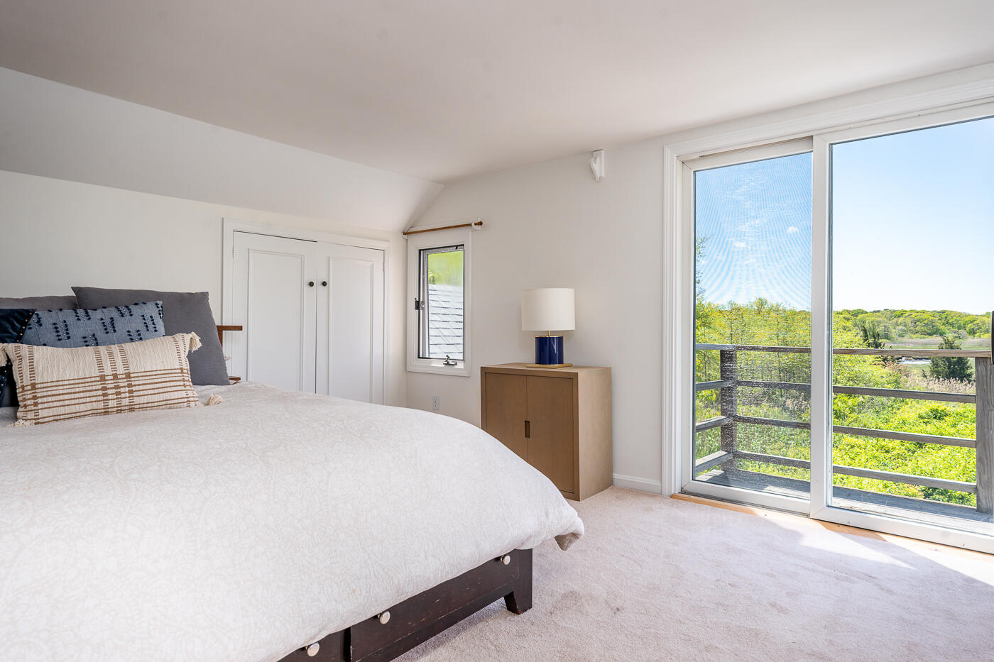 52 Captain Linnell Road Orleans, MA 02653 - Photo 24 of 41 a spacious bedroom with a bed and a cabinets