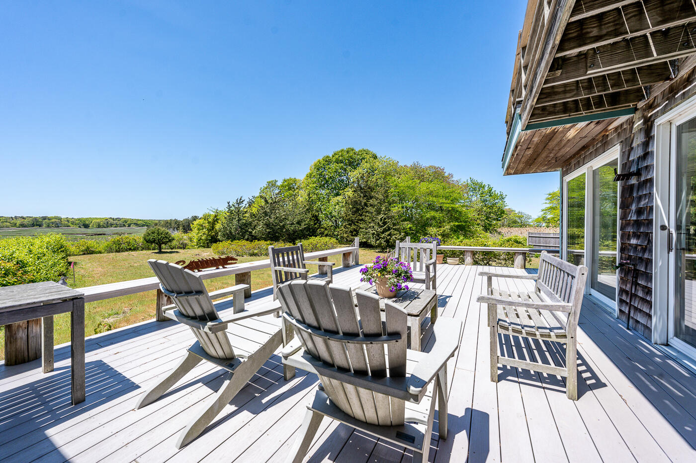 52 Captain Linnell Road Orleans, MA 02653 - Photo 3 of 41 a view of a roof deck with table and chairs and wooden floor