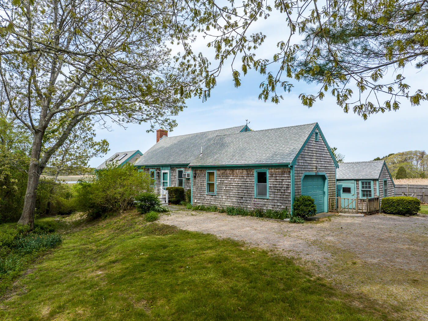 52 Captain Linnell Road Orleans, MA 02653 - Photo 40 of 41 a view of house in front of a big yard with large trees