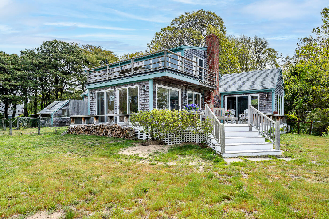 52 Captain Linnell Road Orleans, MA 02653 - Photo 4 of 41 a front view of a house with a yard