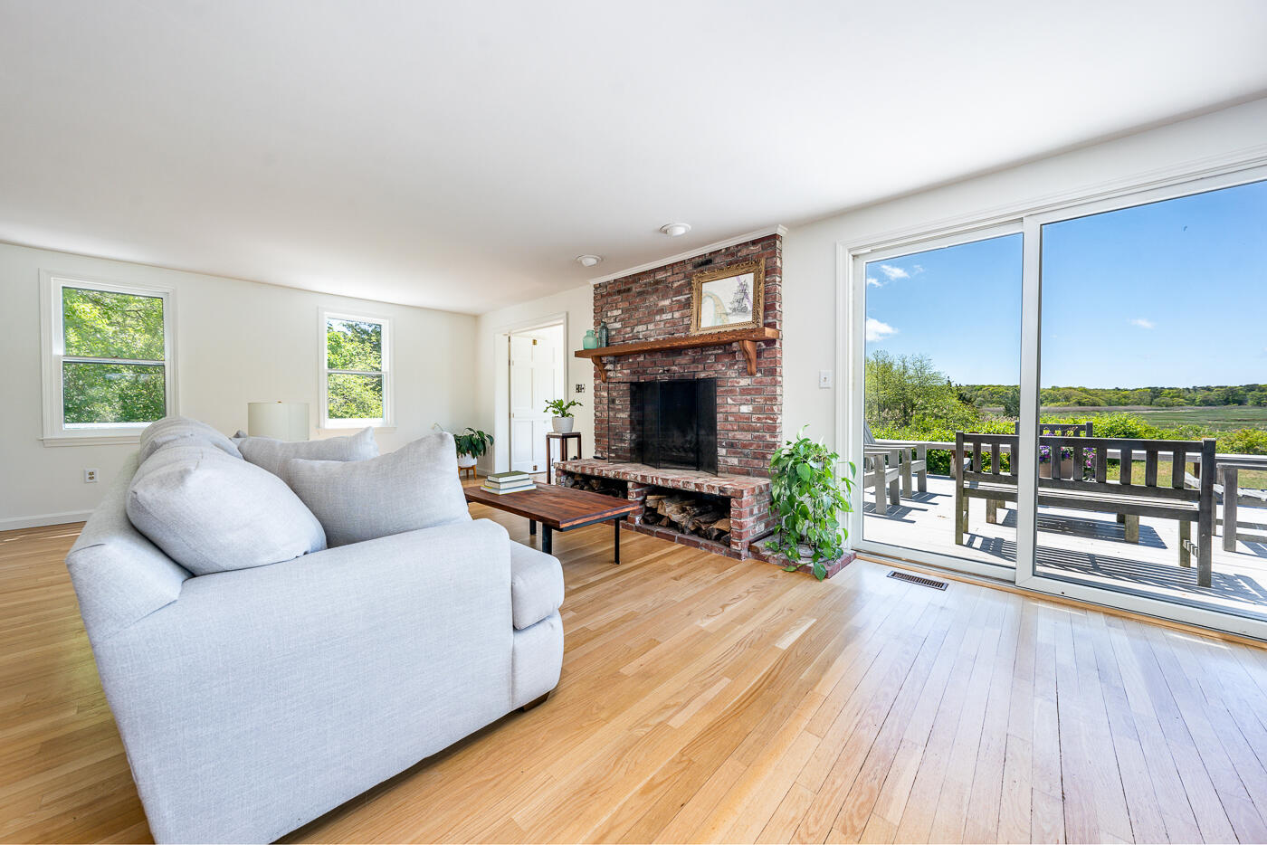 52 Captain Linnell Road Orleans, MA 02653 - Photo 8 of 41 a living room with furniture and a fireplace