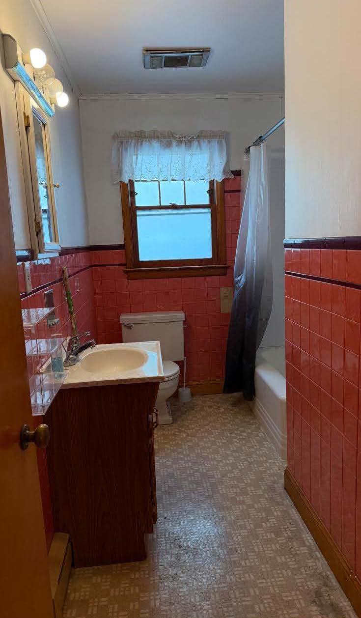 17 Allen Street Catskill, NY 12414 - Photo 8 of 37 a bathroom with a sink and a mirror