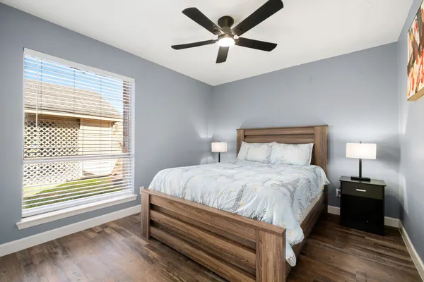a bedroom with bed and window