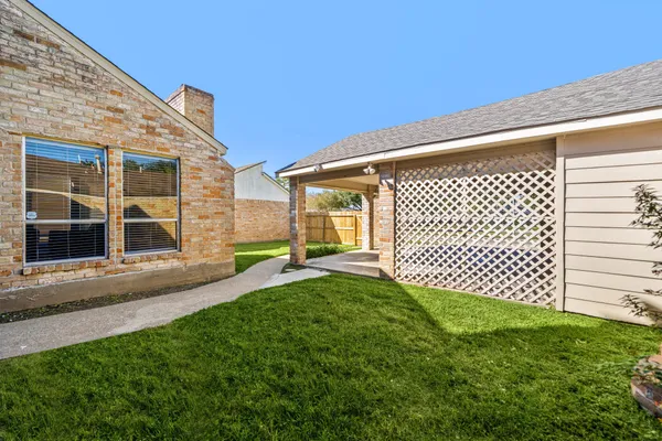 a view of a backyard with a garden