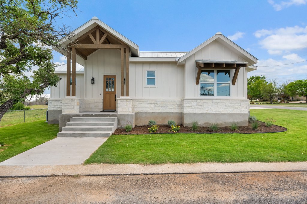 501 Ranchview Drive Johnson City, TX 78636 - Photo 1 of 28 a front view of a house with a yard