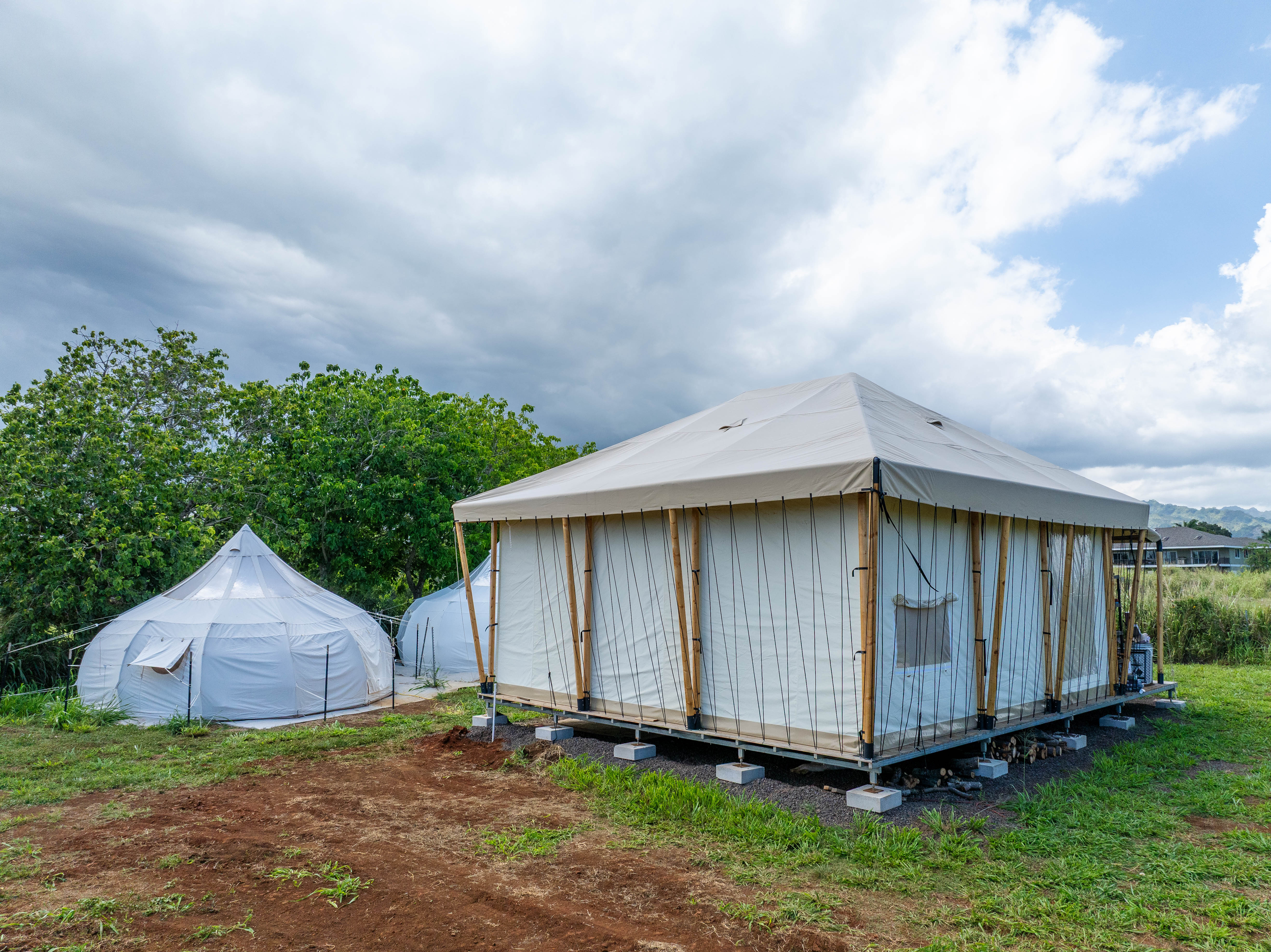 5370 Kaehulua Road Kapaa, HI 96746 - Photo 20 of 25 a view of a small house with a small yard and a large tree