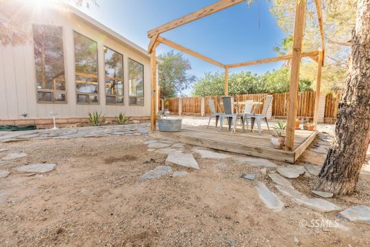 1015 South Mahan Street Ridgecrest, CA 93555 - Photo 26 of 31 a view of a house with a yard from a terrace