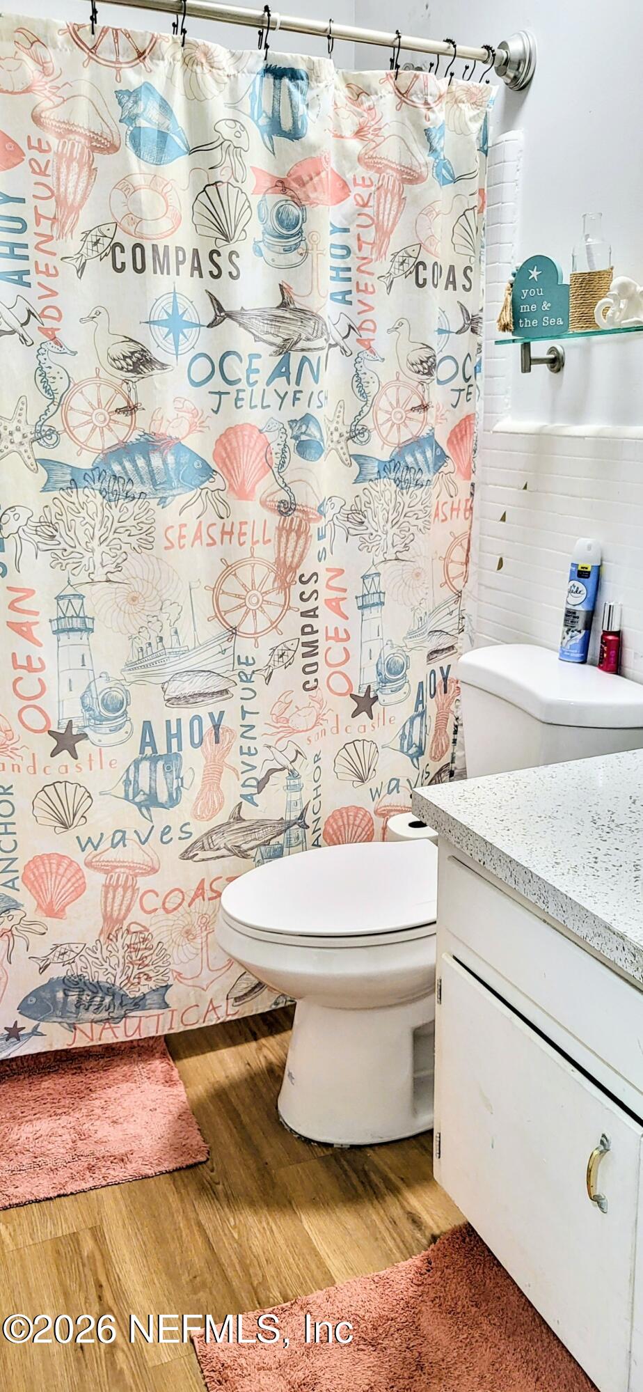 1647 El Camino Road, Unit 5 Jacksonville, FL 32216 - Photo 12 of 36 a bathroom with a granite countertop sink and a toilet