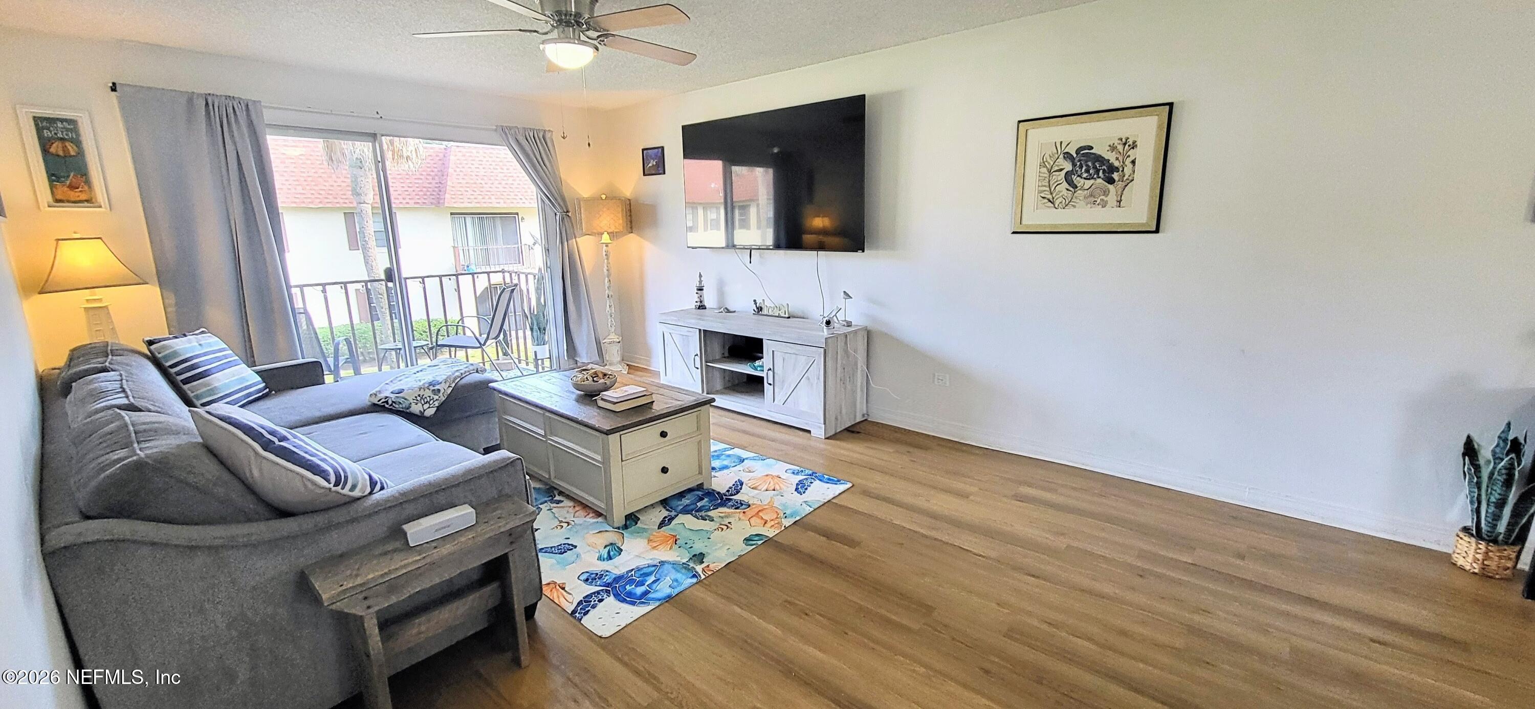 1647 El Camino Road, Unit 5 Jacksonville, FL 32216 - Photo 14 of 36 a living room with furniture and a fireplace