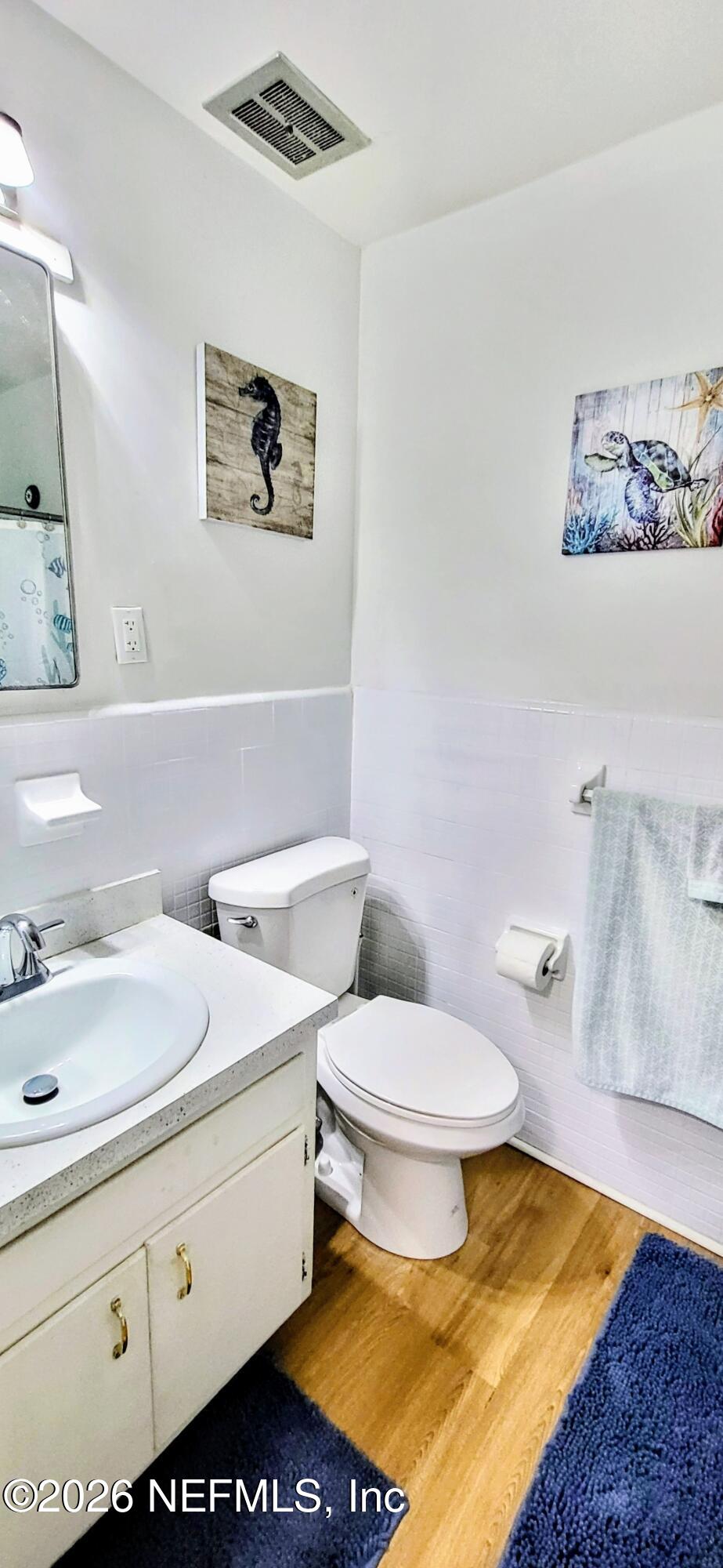 1647 El Camino Road, Unit 5 Jacksonville, FL 32216 - Photo 23 of 36 a bathroom with a sink toilet and vanity