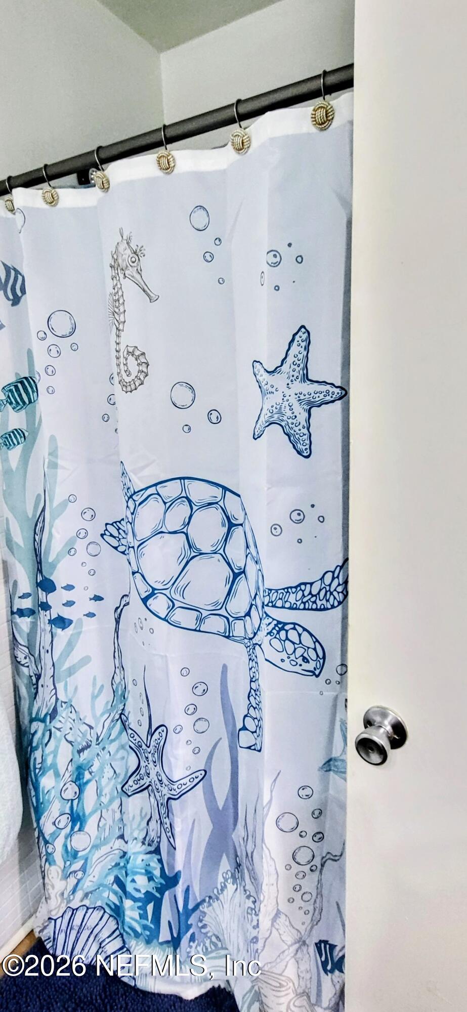 1647 El Camino Road, Unit 5 Jacksonville, FL 32216 - Photo 24 of 36 a bathroom with a bathtub and shower