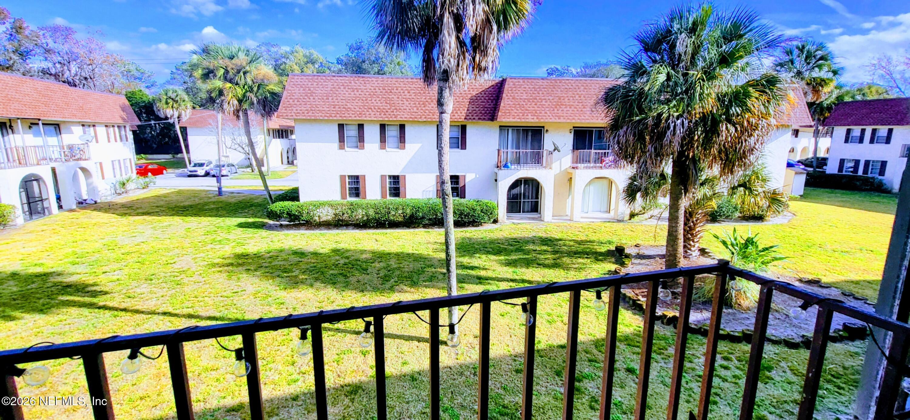 1647 El Camino Road, Unit 5 Jacksonville, FL 32216 - Photo 27 of 36 a view of a house with garden and trees