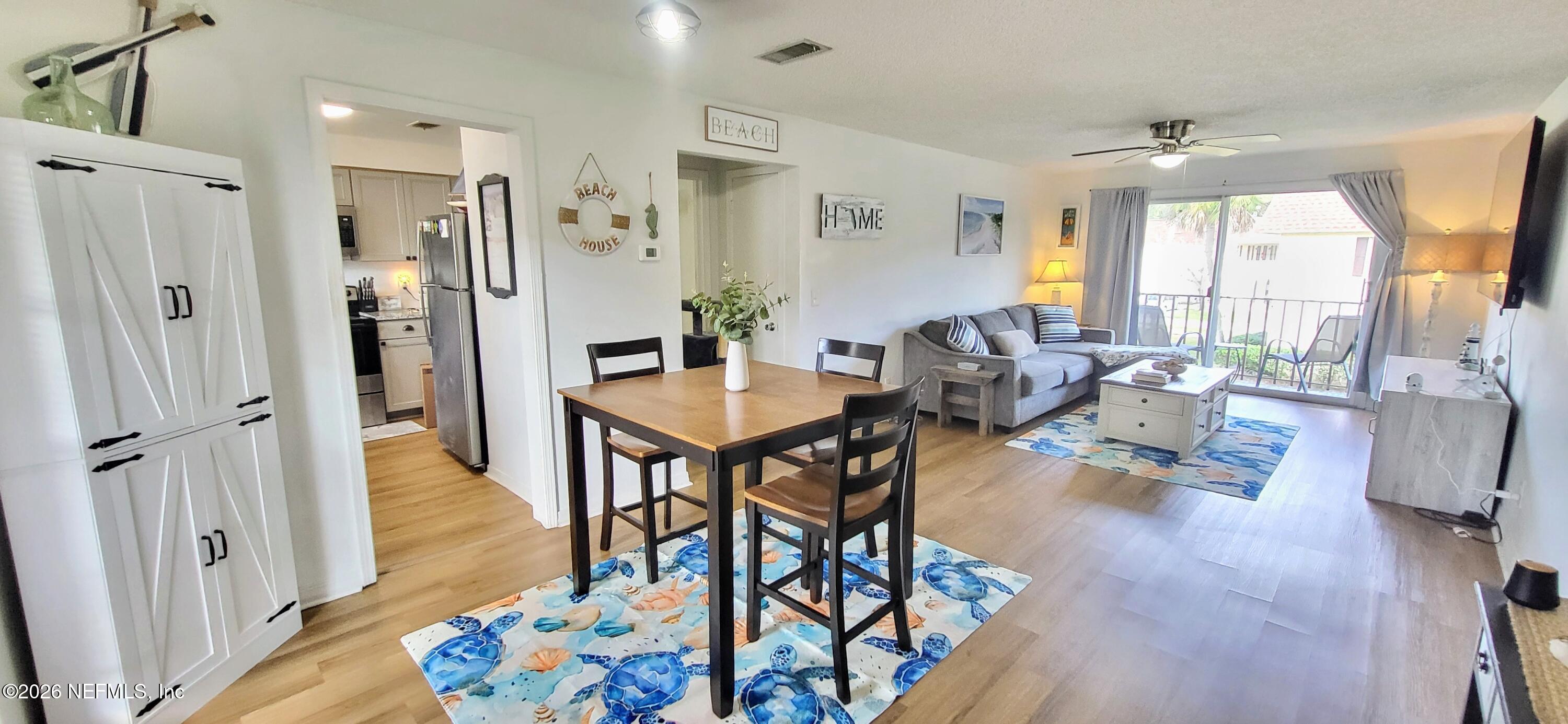 1647 El Camino Road, Unit 5 Jacksonville, FL 32216 - Photo 5 of 36 a living room with furniture and a table