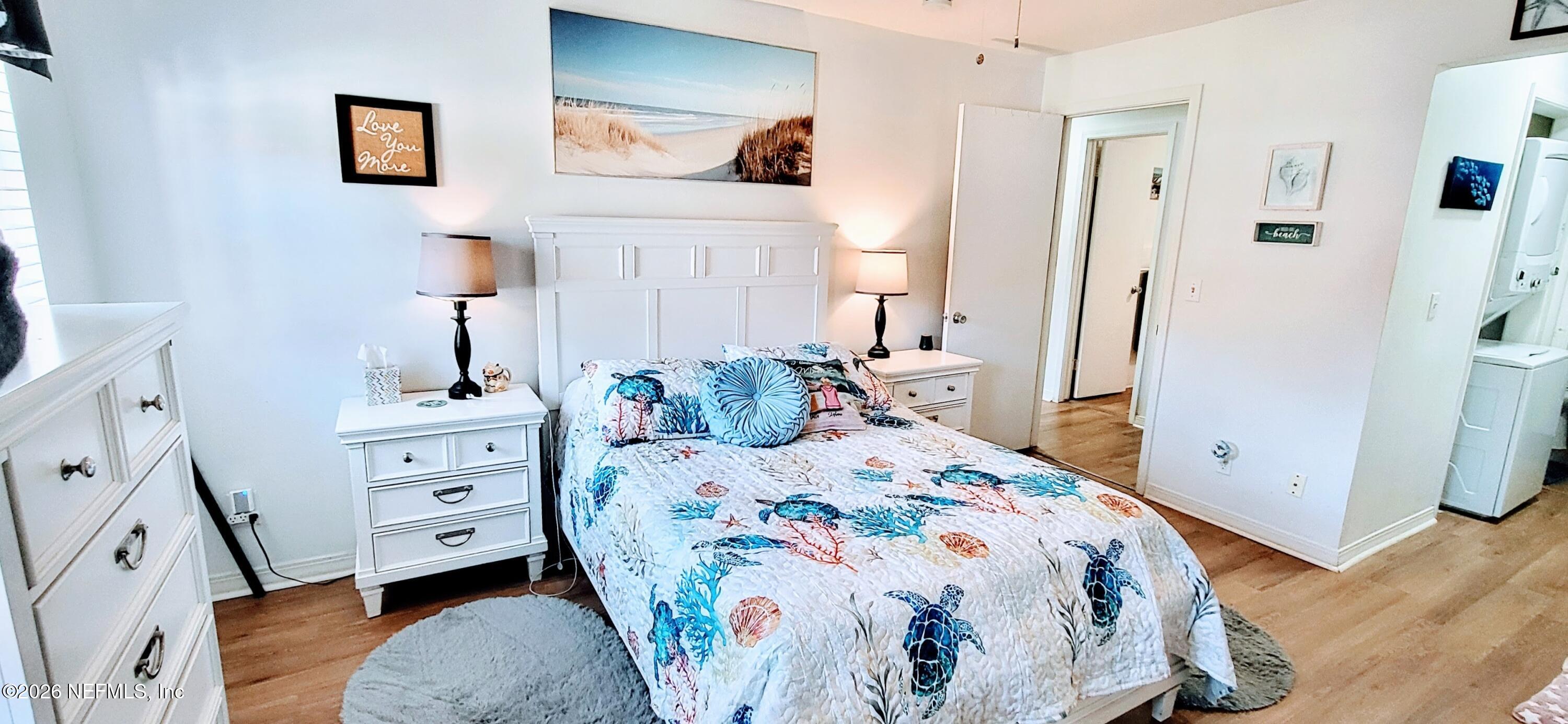 1647 El Camino Road, Unit 5 Jacksonville, FL 32216 - Photo 6 of 36 a bedroom with a bed and wooden floor