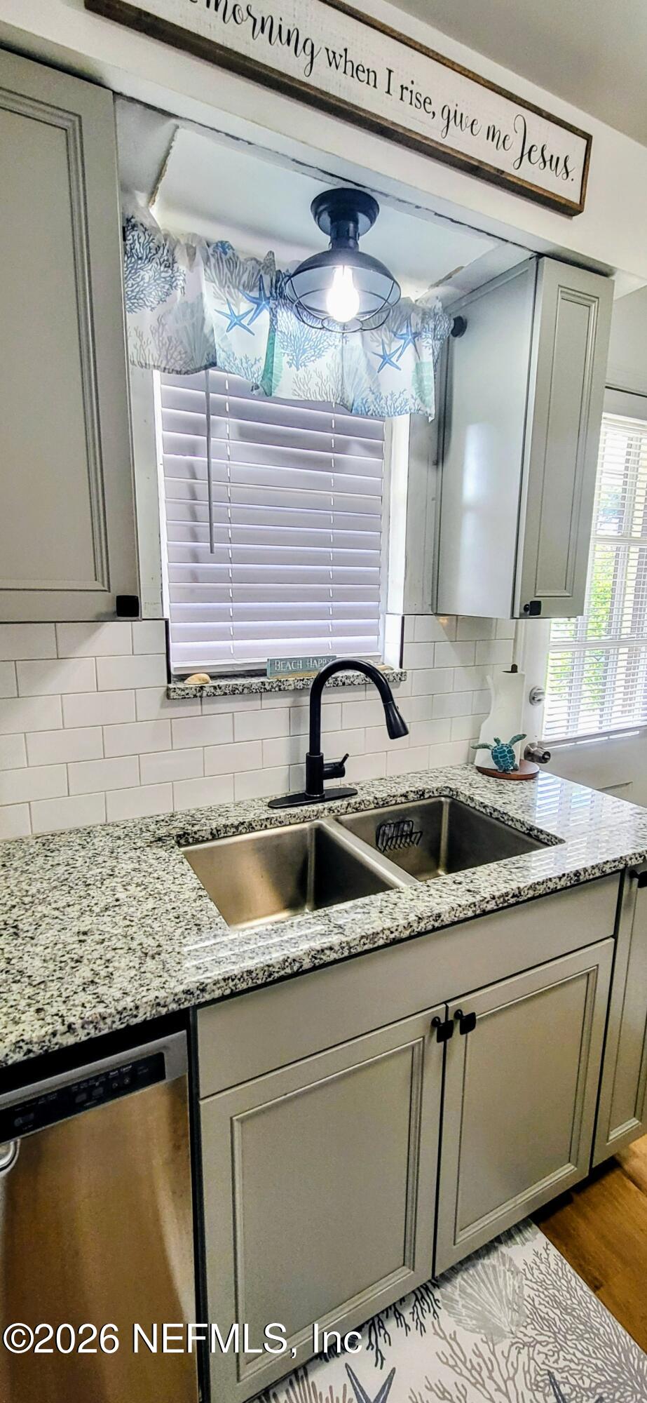 1647 El Camino Road, Unit 5 Jacksonville, FL 32216 - Photo 9 of 36 a kitchen with a sink and cabinets