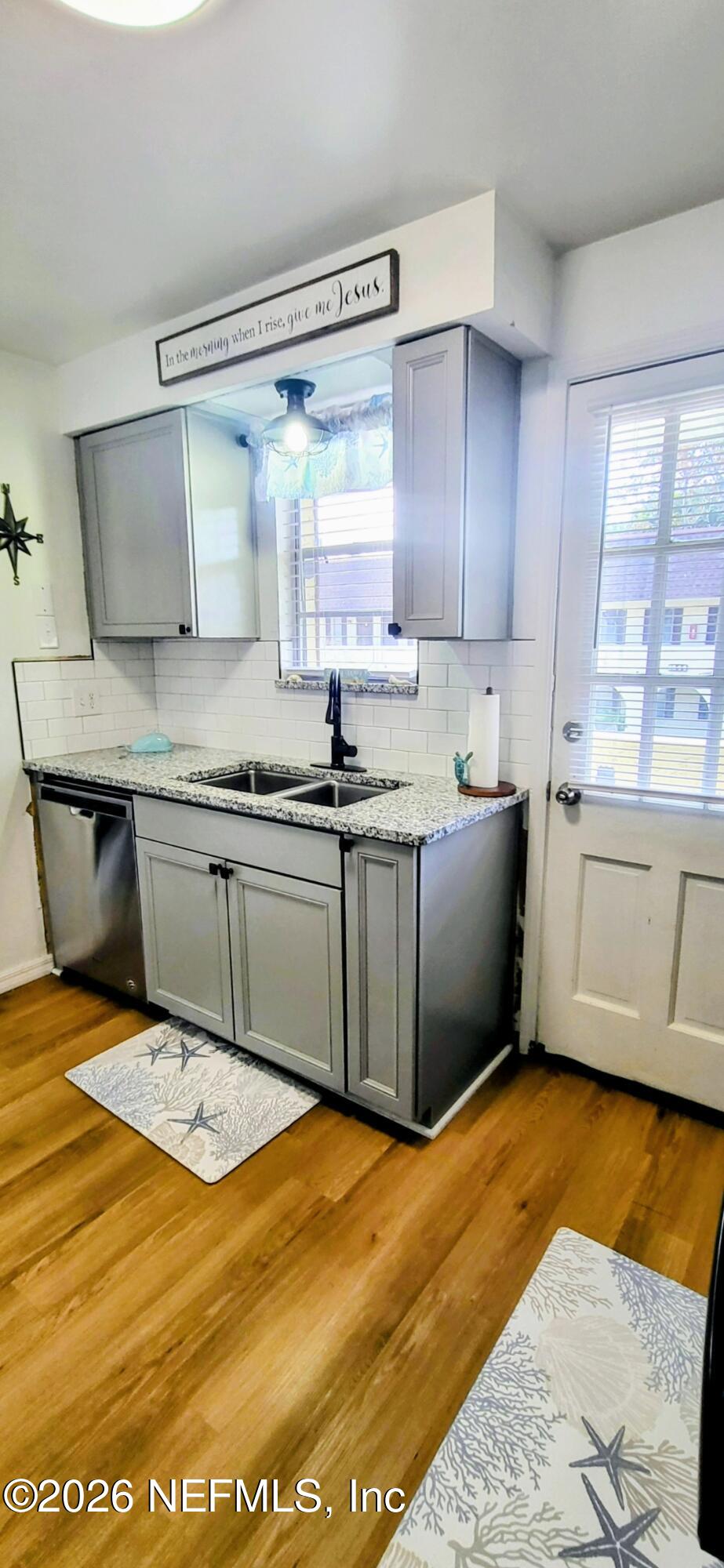 1647 El Camino Road, Unit 5 Jacksonville, FL 32216 - Photo 10 of 36 a kitchen with stainless steel appliances granite countertop a sink dishwasher and granite countertops with cabinets