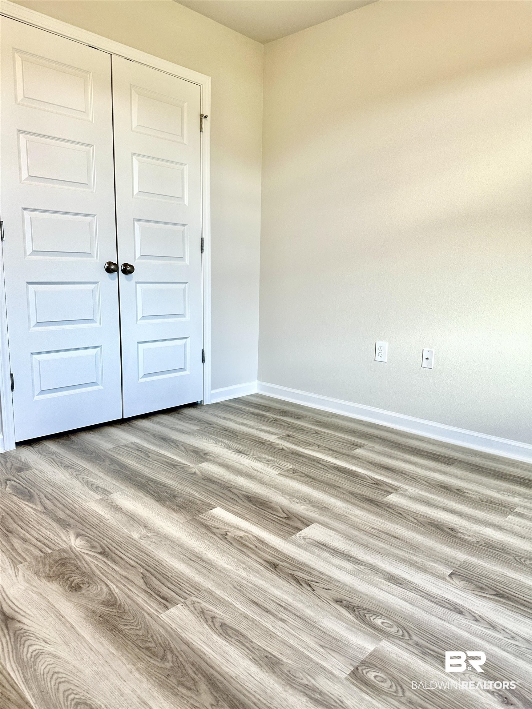 22215 Aleutian Avenue Foley, AL 36535 - Photo 14 of 34 Spare room with wood-type flooring