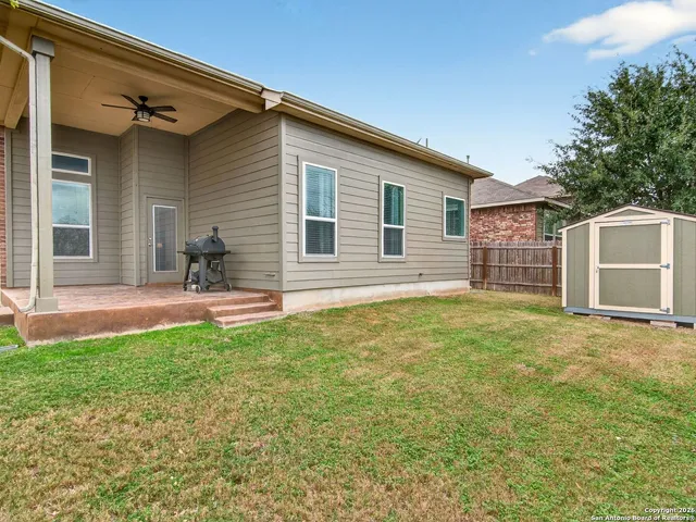 a backyard of a house with seating space