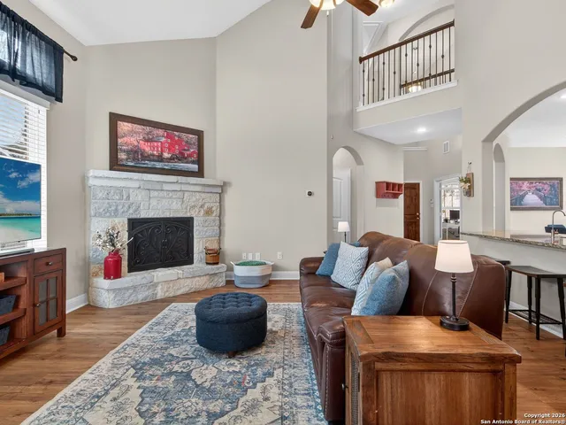 a living room with furniture and a fireplace