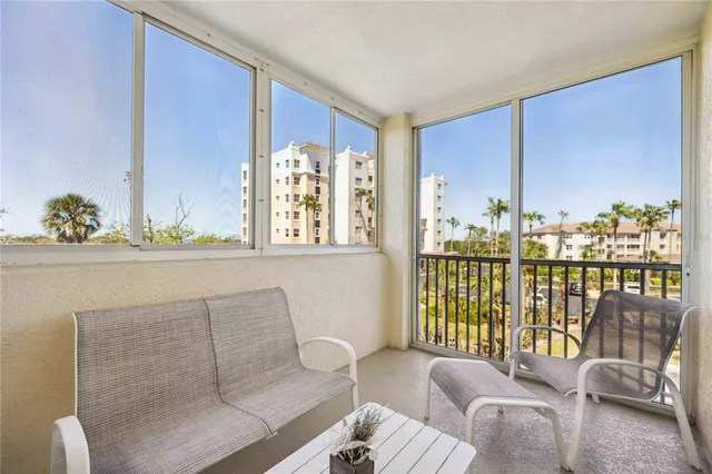 a balcony with furniture and water view