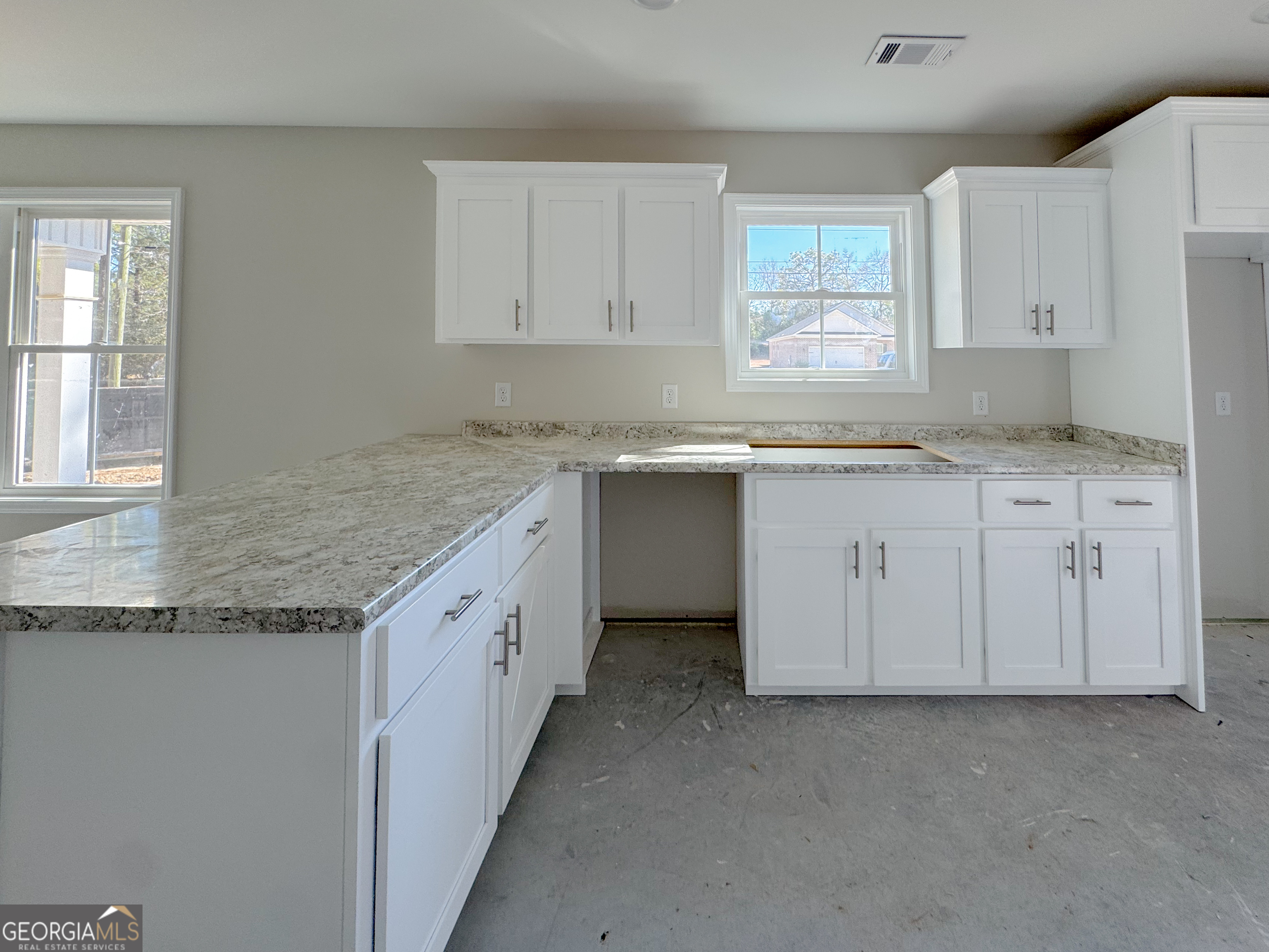 202 Zetterower Road Statesboro, GA 30458 - Photo 15 of 22 a kitchen with granite countertop white cabinets and a sink