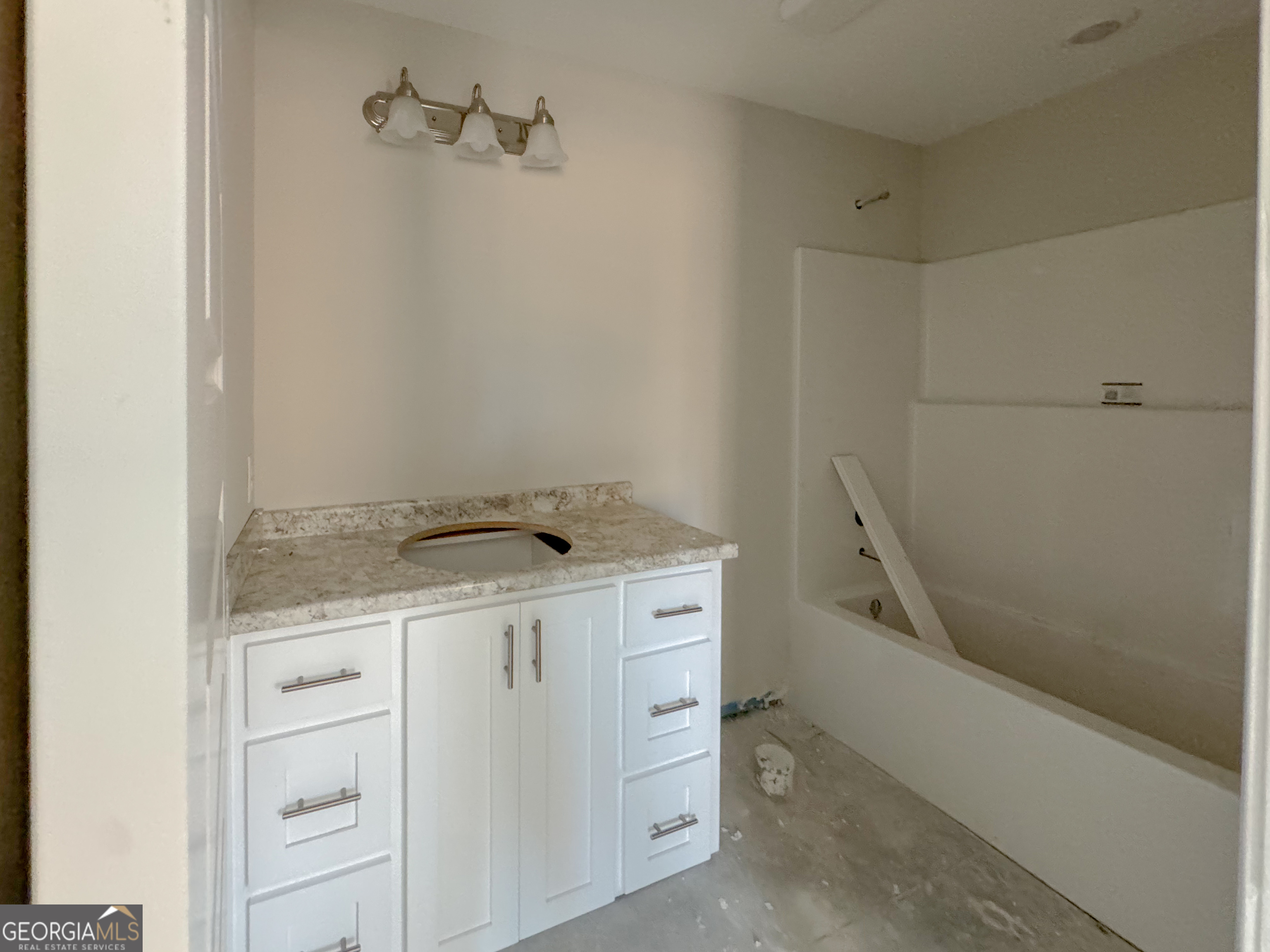 202 Zetterower Road Statesboro, GA 30458 - Photo 19 of 22 a utility room with cabinets washer and dryer