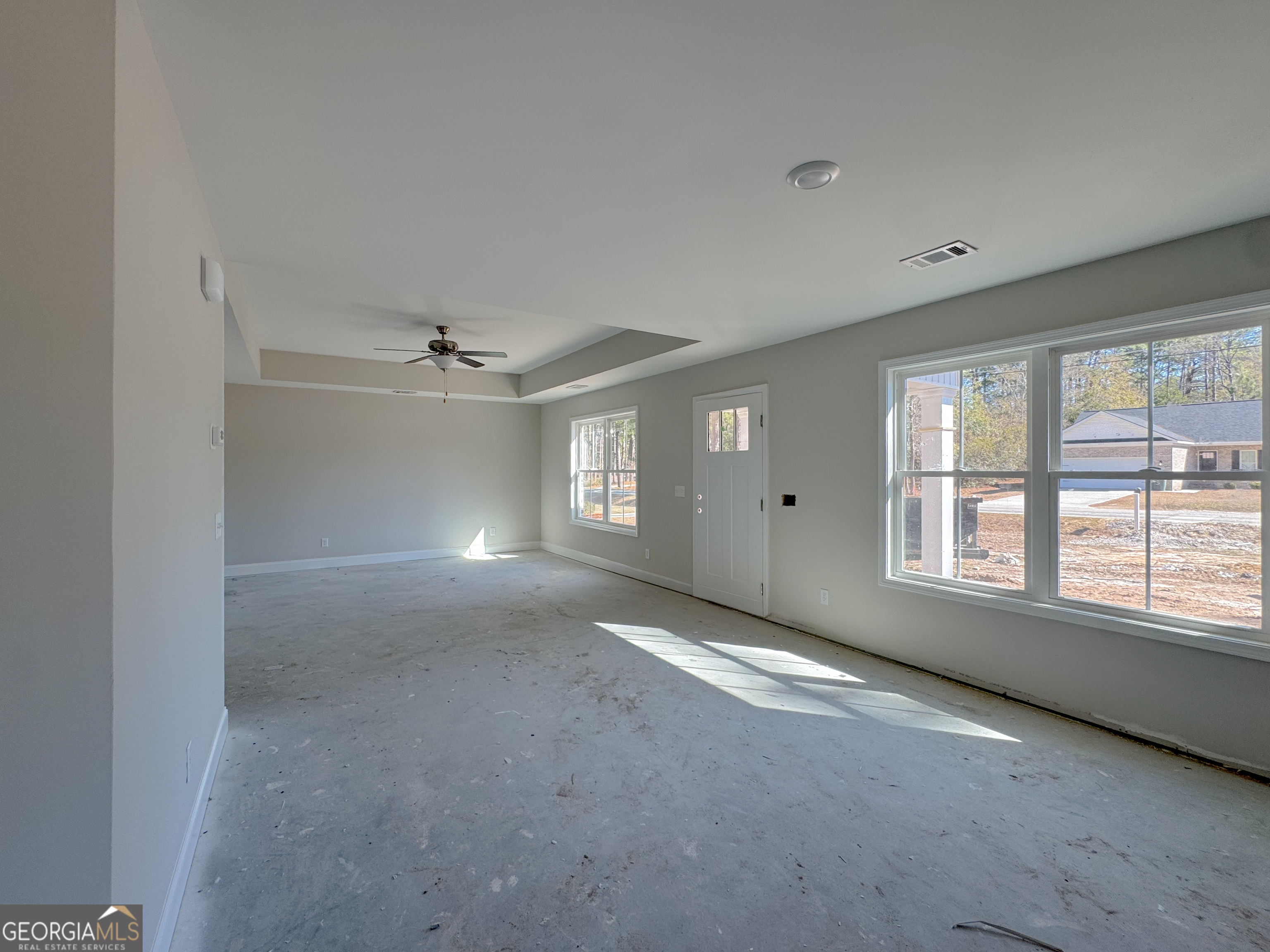202 Zetterower Road Statesboro, GA 30458 - Photo 6 of 22 a view of an empty room with a window