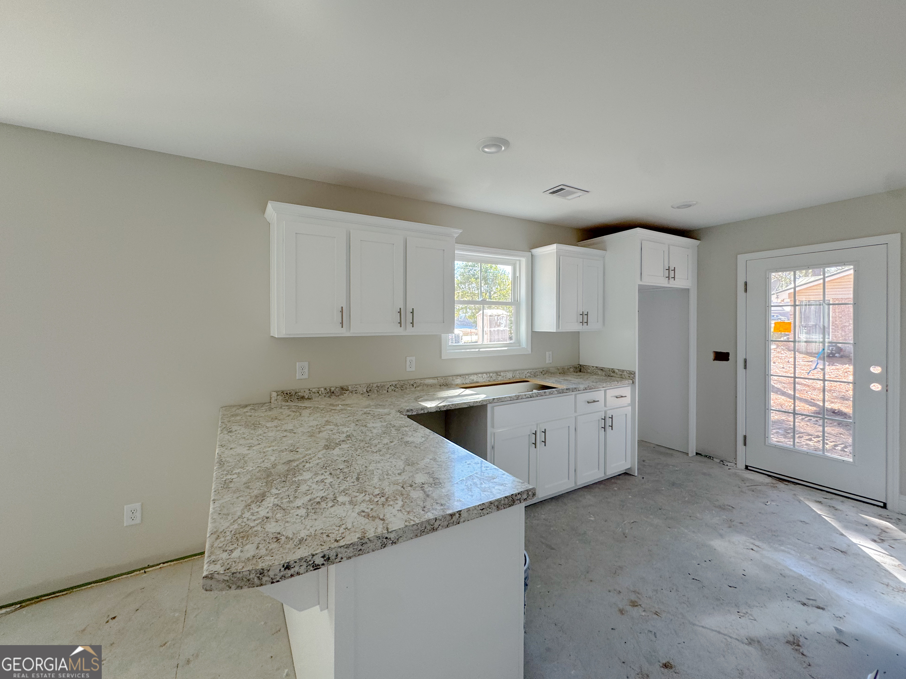 202 Zetterower Road Statesboro, GA 30458 - Photo 9 of 22 a large kitchen with a stove and refrigerator