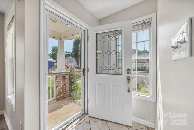 a view of entryway with wooden floor and door