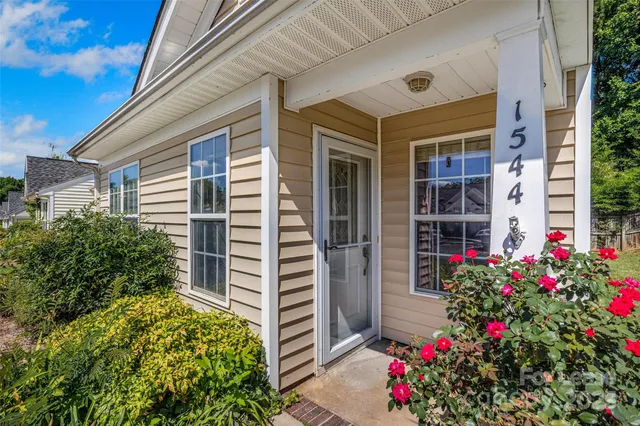 a flower plants in front of a house