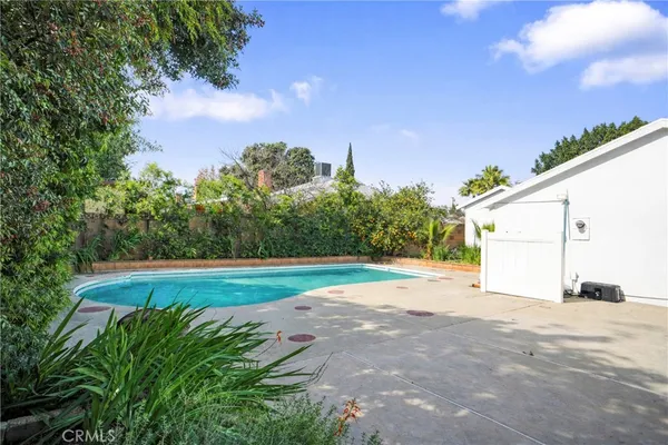 a view of a backyard of the house
