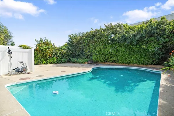 a view of a pool with a yard