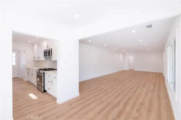 a view of kitchen with wooden floor