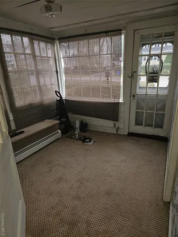 a room with gym equipment and a large window