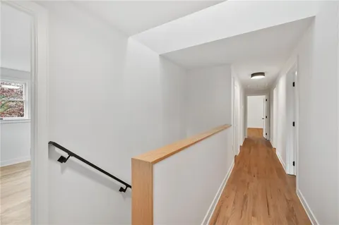 a view of a hallway with a window