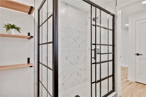 an empty room with wooden floor and window