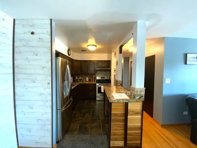 a bedroom with a bed and a flat screen television