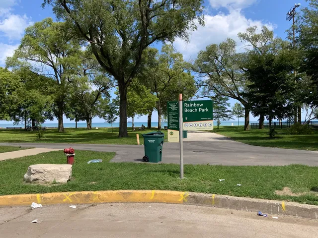 a park with large trees and a pathway