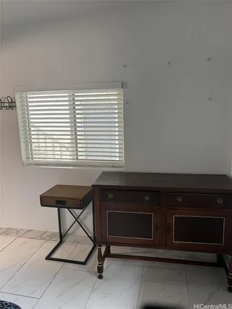a view of a workspace with furniture