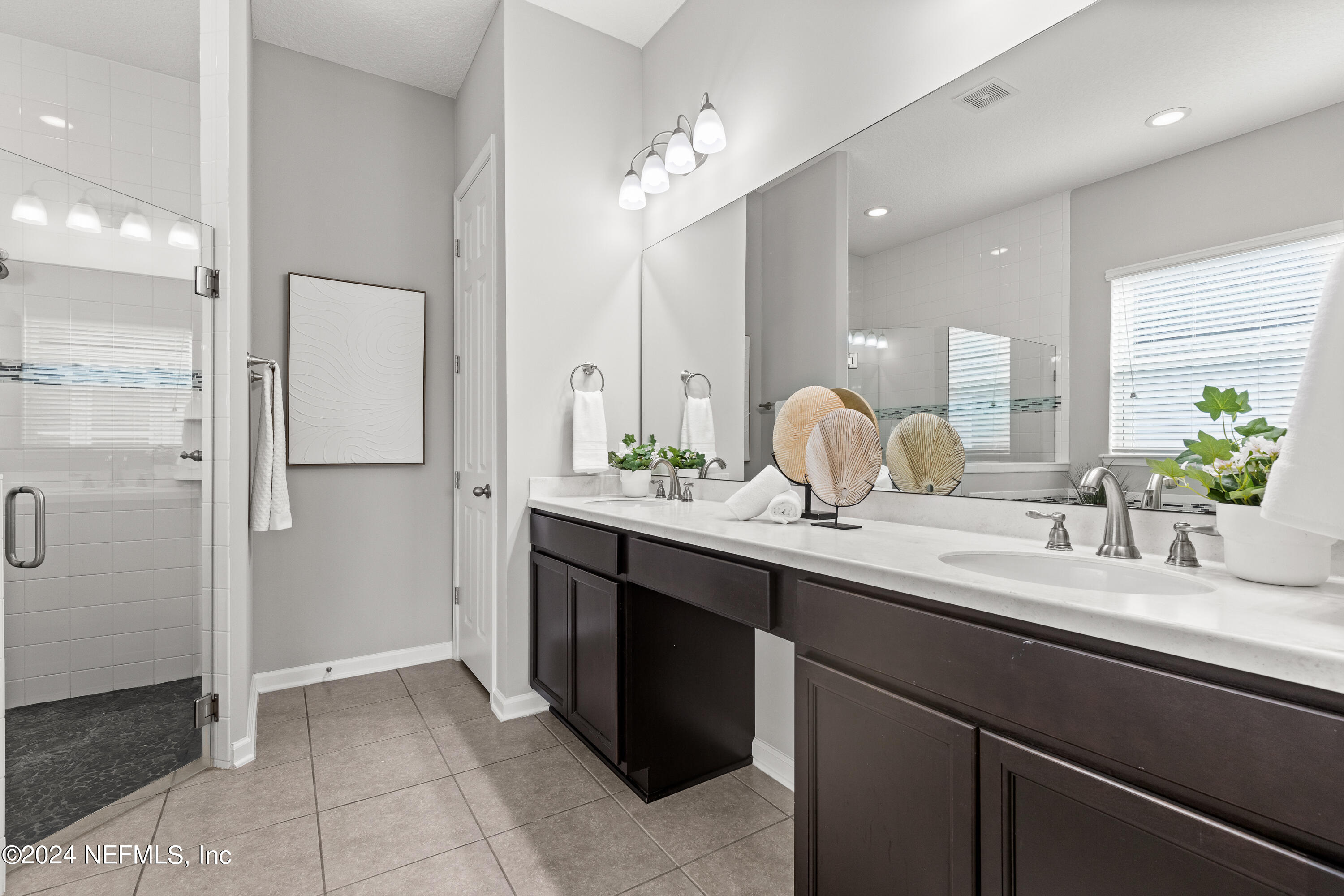 143 Willow Lake Drive St. Augustine, FL 32092 - Photo 15 of 45 a bathroom with a double vanity sink mirror and shower