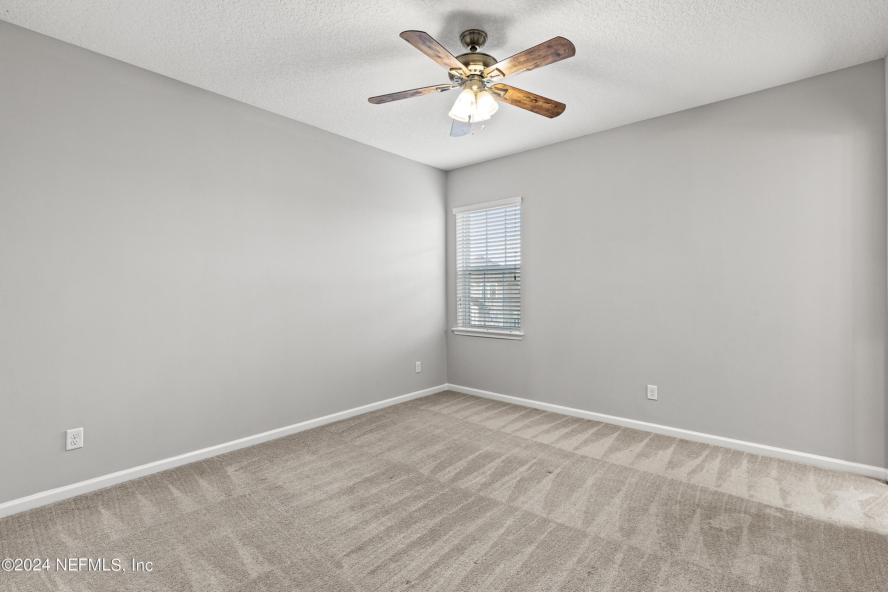 143 Willow Lake Drive St. Augustine, FL 32092 - Photo 26 of 45 a view of empty room with a fan