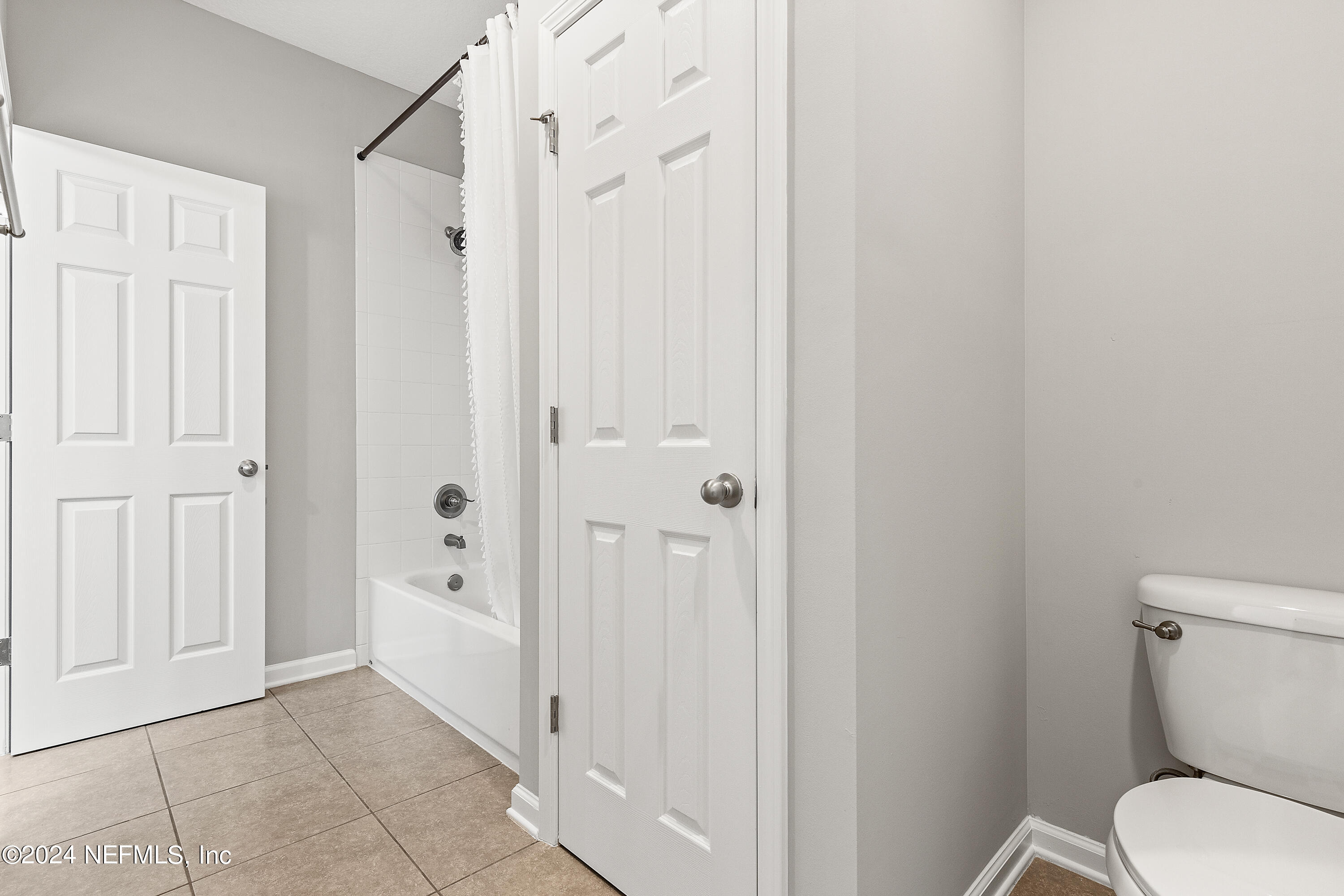 143 Willow Lake Drive St. Augustine, FL 32092 - Photo 28 of 45 a bathroom with a granite countertop toilet and a shower